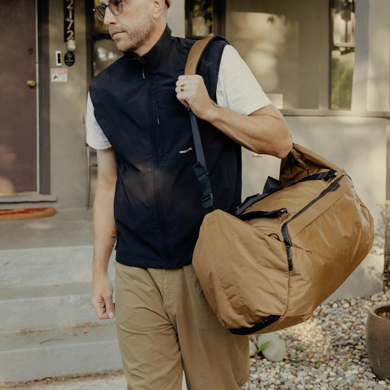 imagePeak Design Travel Duffel ExtraWide Single Zip Access Weatherproof Shell 4 External Pockets Fits Packing Cubes amp Camera Cubes Ideal for Weekend Trips Versatile Duffel Bag for TravelCoyote